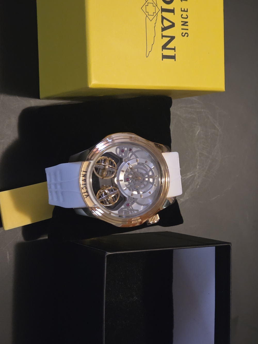 Invicta Rose Gold Skeleton Dial Watch with White Strap and Exposed Tourbillon